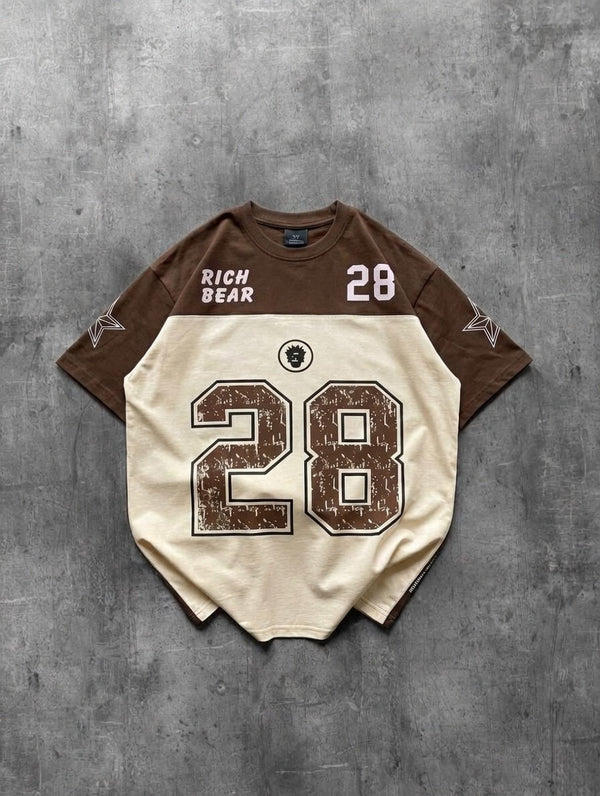 Baseball-style jersey with number 28 on a gray concrete background